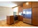 Kitchen with stainless steel fridge and wood cabinets at 4632 Willowbrook Dr, Columbus, IN 47203