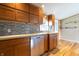 Kitchen featuring wood cabinets and stainless steel dishwasher at 4632 Willowbrook Dr, Columbus, IN 47203