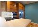 Charming kitchen features stainless steel appliances, wood cabinets, and a smooth cooktop for modern cooking at 4632 Willowbrook Dr, Columbus, IN 47203