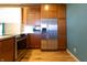 Kitchen with stainless steel appliances and wood cabinets at 4632 Willowbrook Dr, Columbus, IN 47203