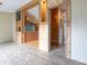 Open floor plan with wood-look flooring, natural wood accents, and decorative display wall art at 4632 Willowbrook Dr, Columbus, IN 47203