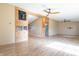 Bright, spacious living room with wood-look flooring, open layout, and stylish ceiling fans at 4632 Willowbrook Dr, Columbus, IN 47203
