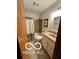 Standard bathroom features a shower-tub combo, vanity with sink, and neutral finishes at 4655 Framington Ct, Indianapolis, IN 46254