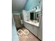 Bathroom featuring dual sinks, white cabinetry, and a large mirror at 4655 Framington Ct, Indianapolis, IN 46254
