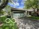 This single-story home features an attached garage and well-manicured landscaping at 4655 Framington Ct, Indianapolis, IN 46254