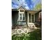 Charming front entrance with a small bench and well-maintained landscaping at 4655 Framington Ct, Indianapolis, IN 46254