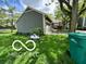 View of the house from the front yard, showing green lawn, house number, and tree at 4655 Framington Ct, Indianapolis, IN 46254