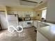 Functional kitchen with white appliances, ample cabinetry, and laminate countertops at 4655 Framington Ct, Indianapolis, IN 46254