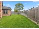 Expansive backyard with lush green grass and privacy fence providing plenty of room for outdoor activities at 4711 Bentley Dr, Carmel, IN 46033