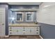Stylish bathroom with double vanity, granite countertop, white cabinetry, and decorative mirrors at 4711 Bentley Dr, Carmel, IN 46033