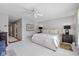 Bedroom featuring a ceiling fan, neutral decor, large window, and cozy ambiance at 4711 Bentley Dr, Carmel, IN 46033