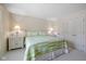 Bright bedroom features a queen-sized bed, nightstands, and closet space at 4711 Bentley Dr, Carmel, IN 46033