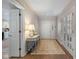 Bright foyer with hardwood floors, console table, and views into other rooms at 4711 Bentley Dr, Carmel, IN 46033