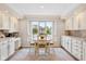 Charming breakfast nook features a round table, four chairs, and a large window with neighborhood views at 4711 Bentley Dr, Carmel, IN 46033