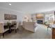 Open-concept living room with a fireplace, dining area, and comfortable seating at 4711 Bentley Dr, Carmel, IN 46033