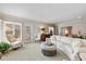 Bright and airy living room with comfortable seating and a view of the backyard at 4711 Bentley Dr, Carmel, IN 46033
