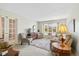 Inviting living room with a large window, plush seating, and a view of the outdoors at 4711 Bentley Dr, Carmel, IN 46033