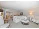 Spacious living room featuring hardwood floors, a comfortable sofa, and natural light at 4711 Bentley Dr, Carmel, IN 46033