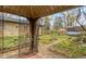 Landscaped backyard featuring a charming gazebo and delightful water feature for relaxation and outdoor enjoyment at 5005 Bonnie Brae St, Indianapolis, IN 46228