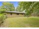 This home offers a spacious backyard with mature trees, and stone exterior at 5005 Bonnie Brae St, Indianapolis, IN 46228