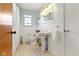 Classic bathroom featuring a pedestal sink and light-colored walls at 5005 Bonnie Brae St, Indianapolis, IN 46228