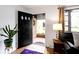 Bright entryway with hardwood floors and view to a charming front porch at 5005 Bonnie Brae St, Indianapolis, IN 46228