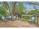Inviting back deck with a table, chairs, and view of the landscaped yard at 5254 Kingsley Dr, Indianapolis, IN 46220