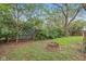 View of the home's backyard, with fire pit and landscaping at 5254 Kingsley Dr, Indianapolis, IN 46220