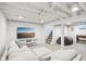Finished basement featuring a large sectional sofa, gray carpet, and exposed beams at 5254 Kingsley Dr, Indianapolis, IN 46220