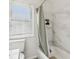 Bright bathroom featuring tiled walls and a shower with modern fixtures at 5254 Kingsley Dr, Indianapolis, IN 46220