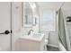 Bright bathroom features a modern vanity, updated fixtures, and tiled shower at 5254 Kingsley Dr, Indianapolis, IN 46220