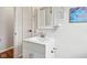 Bathroom featuring a bright vanity with a white sink, a modern faucet, and a neutral color scheme at 5254 Kingsley Dr, Indianapolis, IN 46220