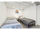 Finished basement bedroom featuring twin beds and exposed beams at 5254 Kingsley Dr, Indianapolis, IN 46220