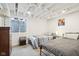 Finished basement bedroom featuring twin beds, carpet, and exposed beams at 5254 Kingsley Dr, Indianapolis, IN 46220