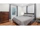 Relaxing bedroom features a comfortable bed, natural light, and dresser at 5254 Kingsley Dr, Indianapolis, IN 46220