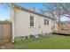 Exterior view of the home, showing the siding, deck, and backyard at 5254 Kingsley Dr, Indianapolis, IN 46220