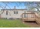 Exterior view of the home, showing the deck and landscaping at 5254 Kingsley Dr, Indianapolis, IN 46220