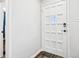 Bright white front door with panels stands in a white room at 5254 Kingsley Dr, Indianapolis, IN 46220