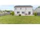Spacious backyard featuring a patio, lawn, and partial fencing for outdoor enjoyment at 5849 Wooden Branch Dr, Indianapolis, IN 46221