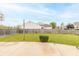 Backyard featuring a wooden fence, firepit, and a grass lawn at 5849 Wooden Branch Dr, Indianapolis, IN 46221