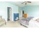 Bedroom featuring light blue walls, a ceiling fan, and multiple closets at 5849 Wooden Branch Dr, Indianapolis, IN 46221