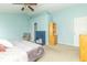 Bright and airy bedroom featuring light blue walls and multiple dressers at 5849 Wooden Branch Dr, Indianapolis, IN 46221