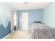 Bedroom with blue walls, a single bed, and a mountain mural accent wall at 5849 Wooden Branch Dr, Indianapolis, IN 46221
