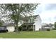 Charming two-story home with blue shutters and a well-maintained lawn at 5849 Wooden Branch Dr, Indianapolis, IN 46221