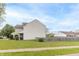 Home exterior showcases a verdant lawn, clean siding, and residential fencing for a safe, inviting environment at 5849 Wooden Branch Dr, Indianapolis, IN 46221