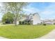 Attractive home featuring a green lawn, two-car garage and a pleasing two-story design for comfortable living at 5849 Wooden Branch Dr, Indianapolis, IN 46221