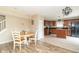 Eat-in kitchen featuring dark cabinets, matching appliances, and an island with a butcher block top at 5849 Wooden Branch Dr, Indianapolis, IN 46221