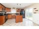 Well-appointed kitchen with dark cabinets, stainless steel appliances, and a butcher block island at 5849 Wooden Branch Dr, Indianapolis, IN 46221