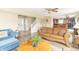 Bright living room showcasing hardwood floors, an open staircase, and comfortable seating at 5849 Wooden Branch Dr, Indianapolis, IN 46221