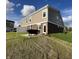 Tan vinyl siding and brick accent the backyard and patio with grill at 6040 Bluecrest Dr, Brownsburg, IN 46234